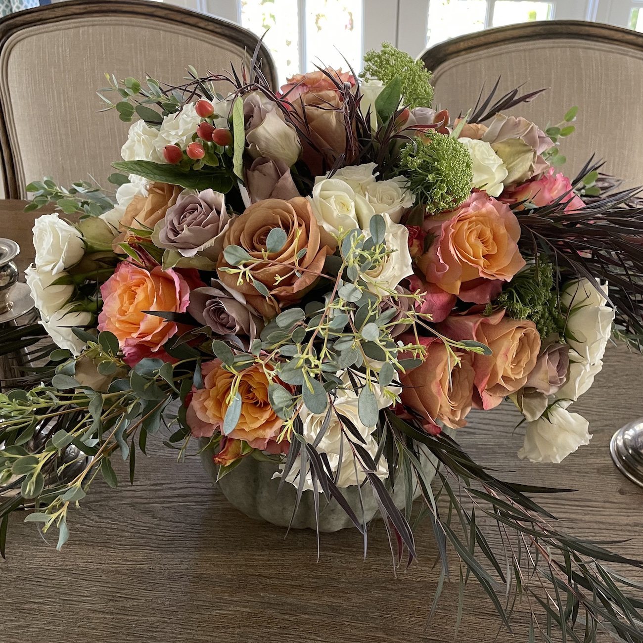 fall floral arrangement in pumpkin