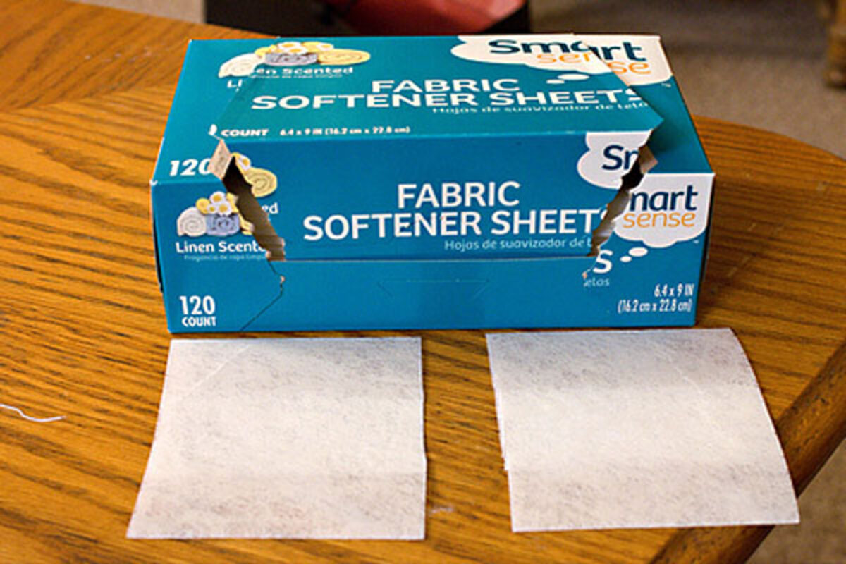 dryer sheet on polished wood table