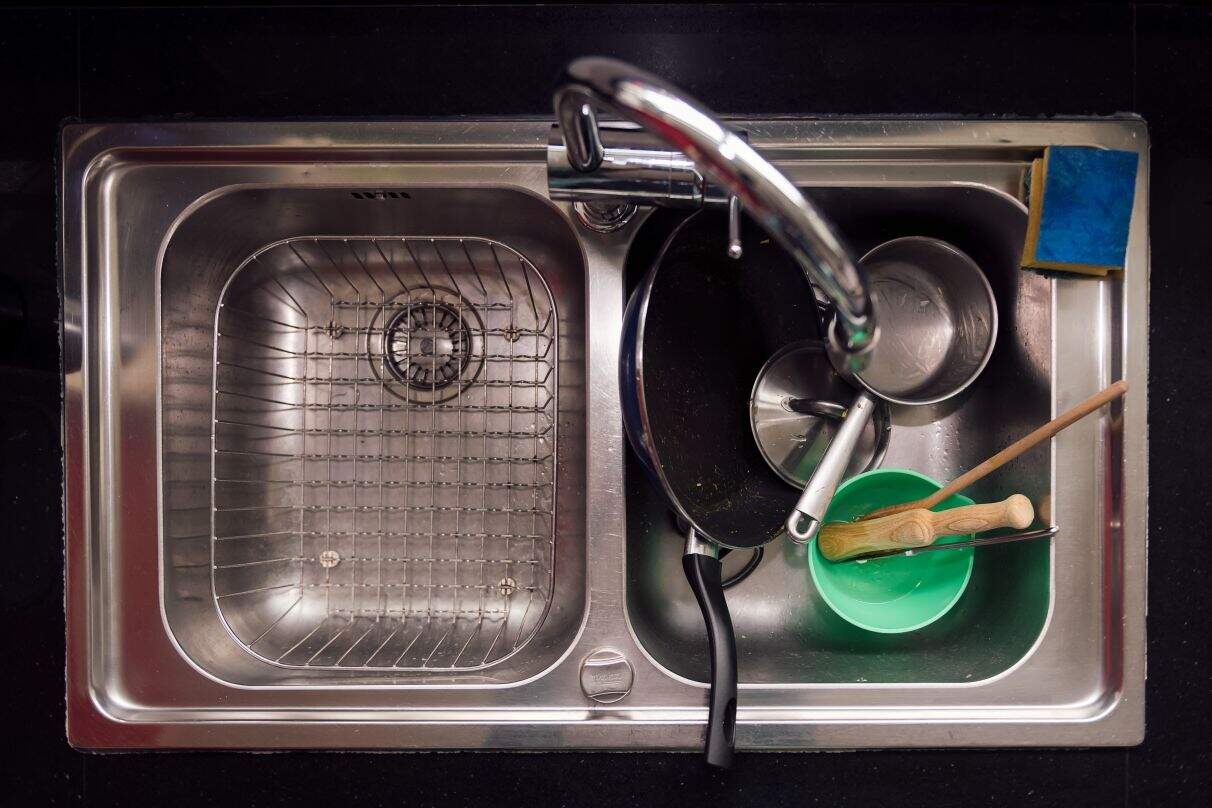 vinegar poured into kitchen drain