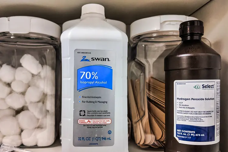 rubbing alcohol bottle with cleaning cloth