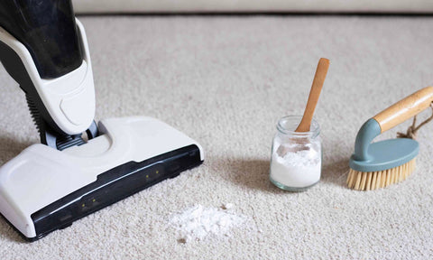 baking soda sprinkled on carpet with vacuum