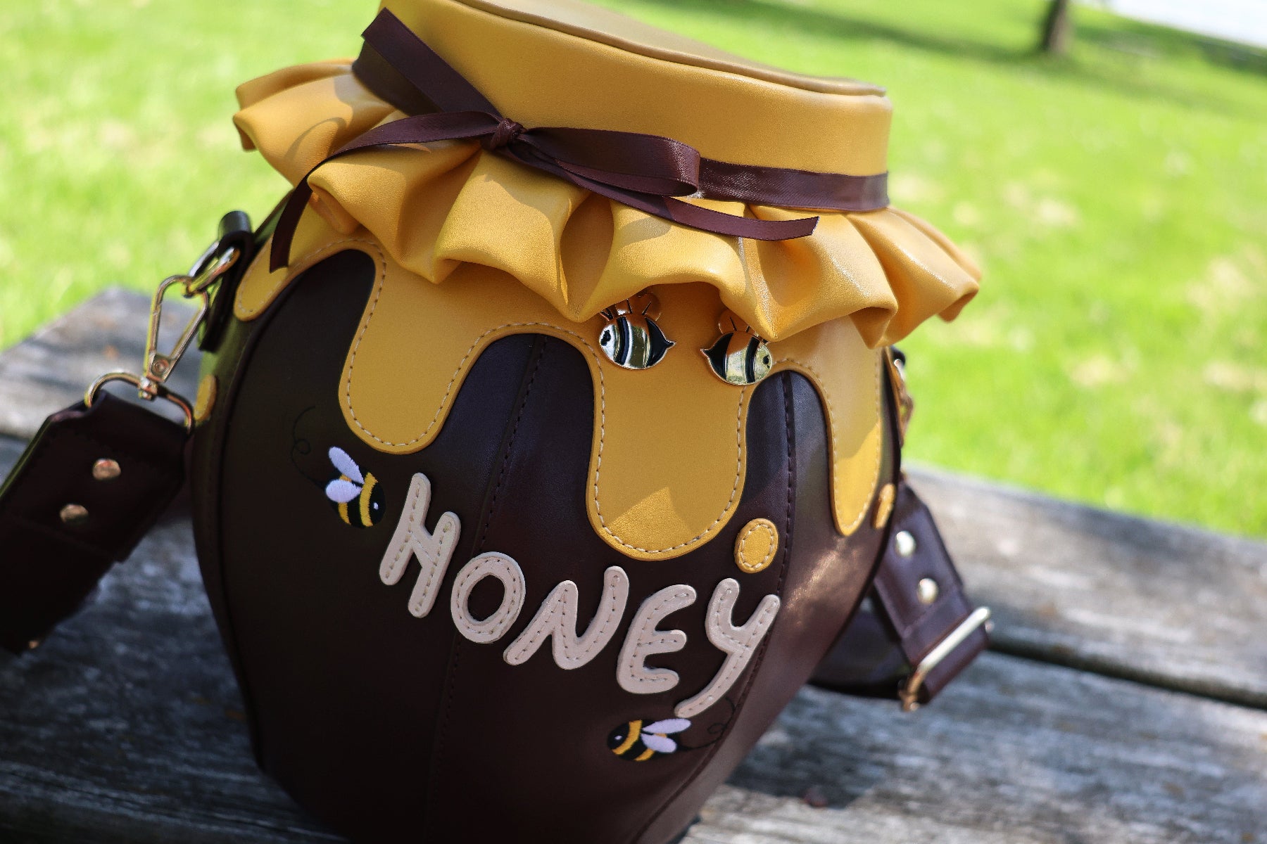 close up of thick honey dripping from jar