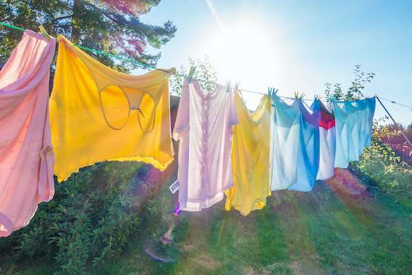 laundered clothes hanging in sunlight