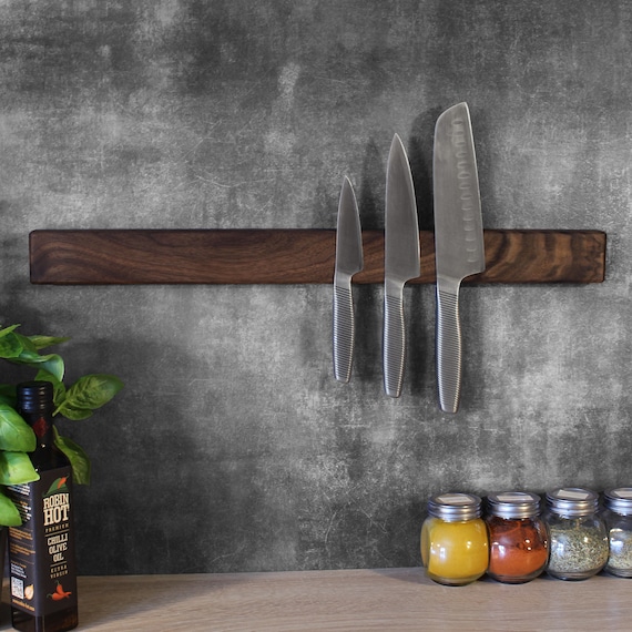 magnetic knife strip mounted on kitchen wall