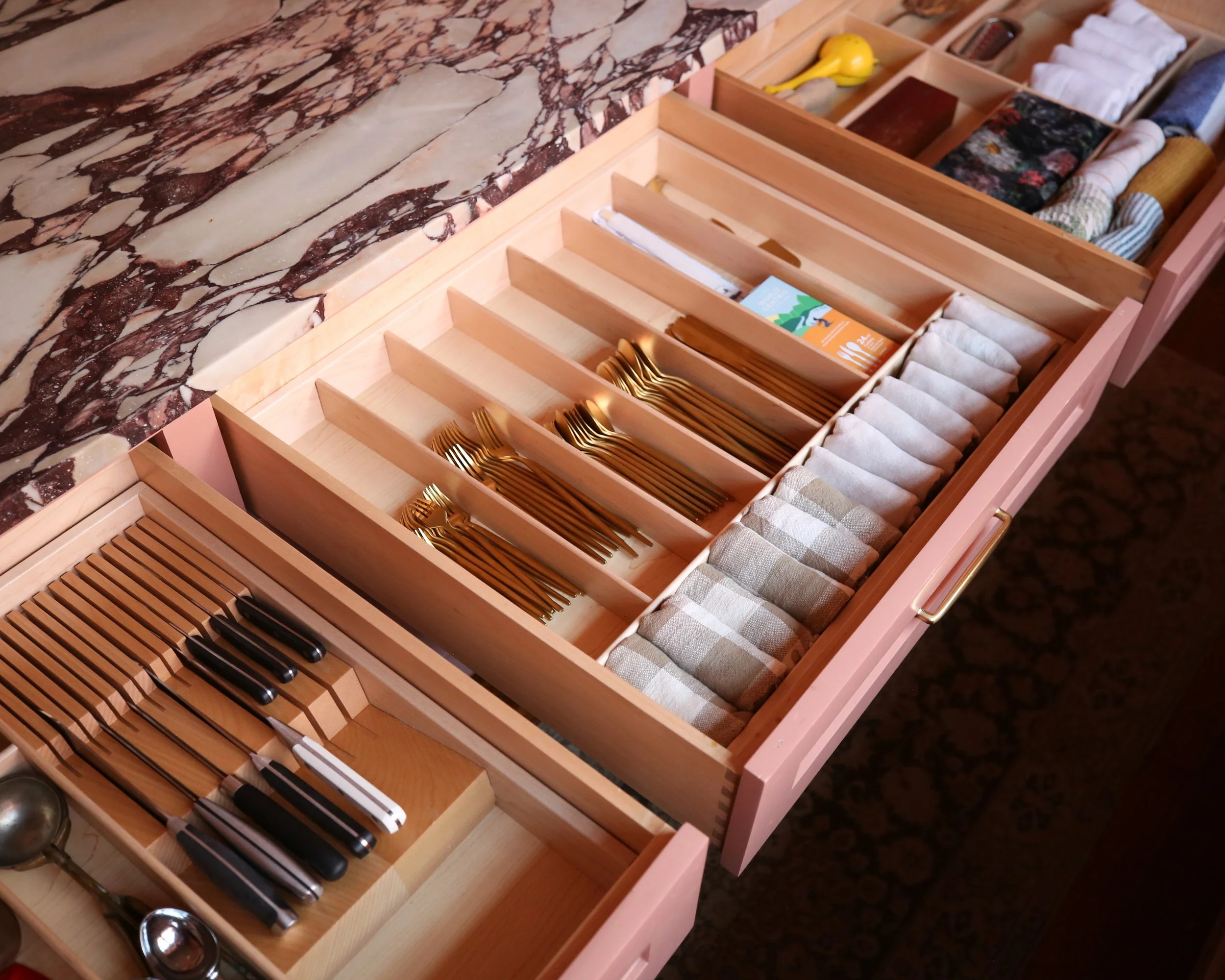 kitchen drawer with dividers organizing utensils