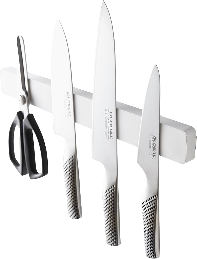 bathroom wall magnetic strip holding grooming tools