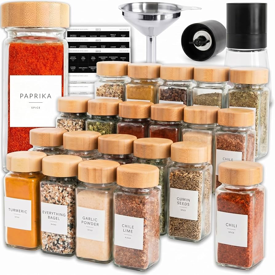 glass spice jars with labels on shelf
