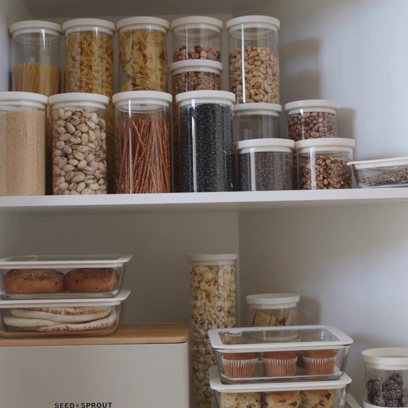 glass storage jars on pantry shelf