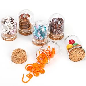 glass jars holding buttons and beads