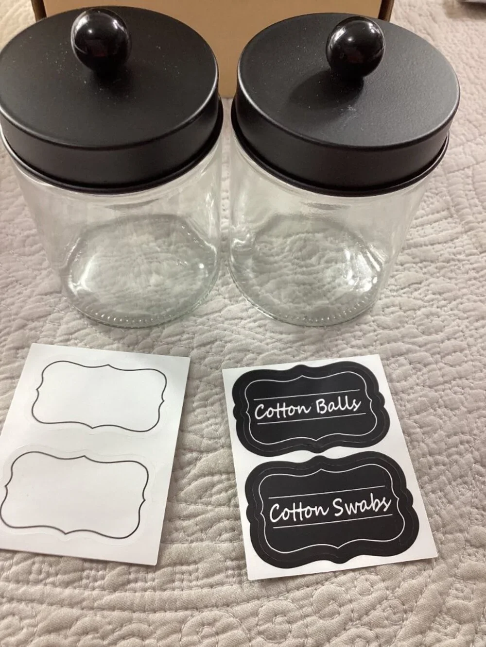 glass jar with cotton balls and swabs