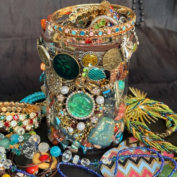 glass jars with necklaces and rings