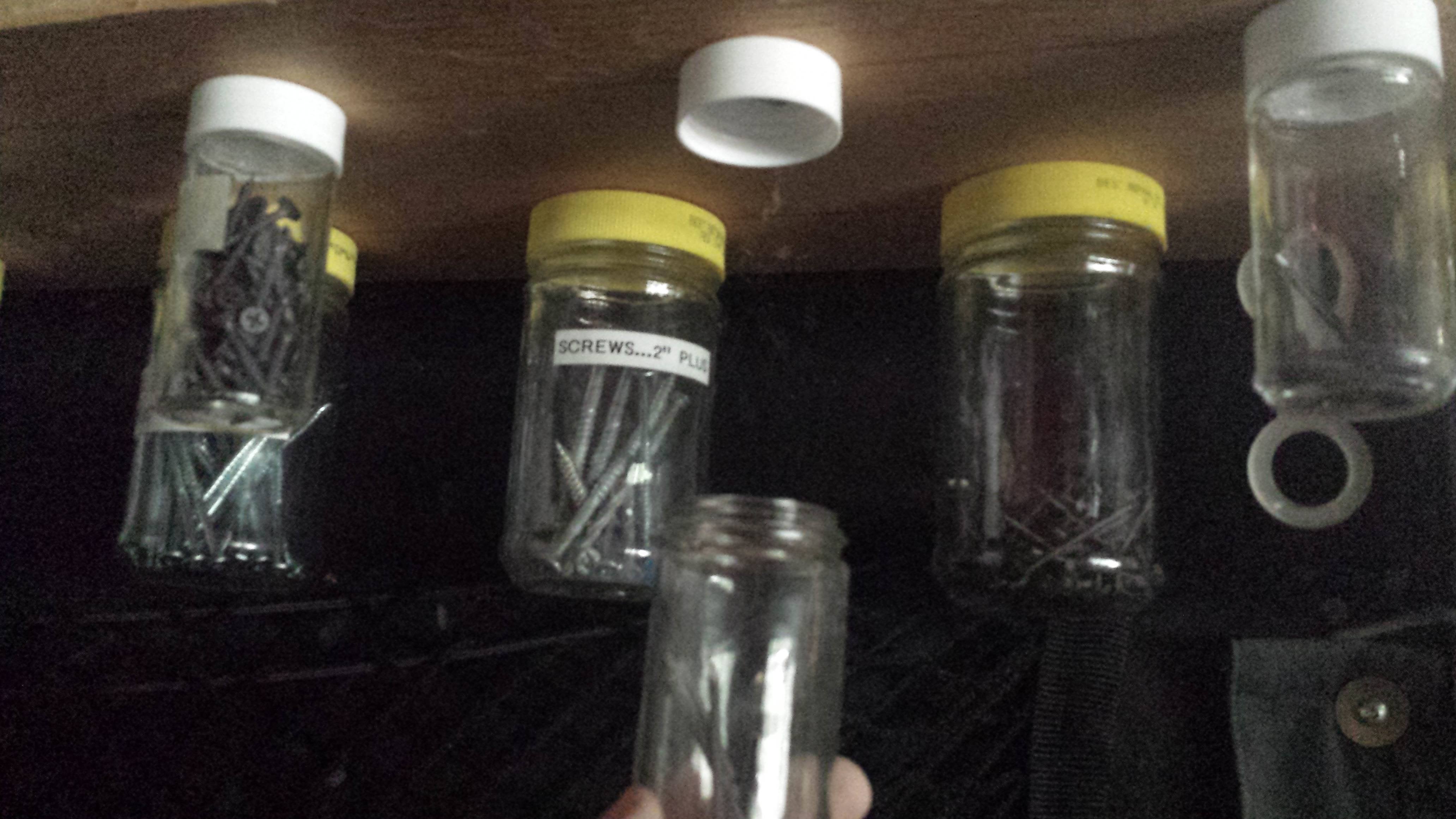 glass jars with screws and nails