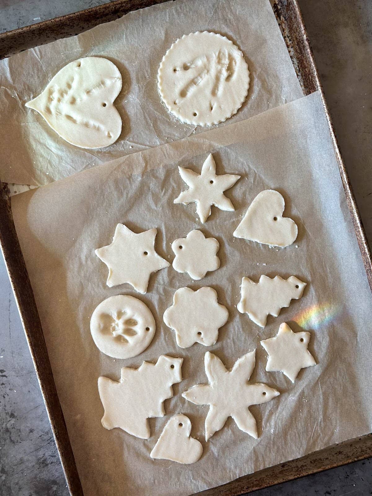 salt dough shapes on parchment paper