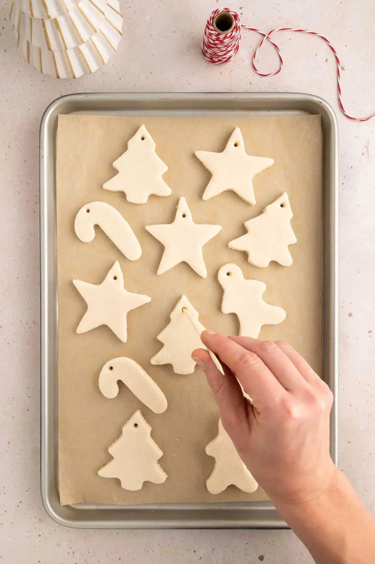 salt dough cutouts on baking sheet