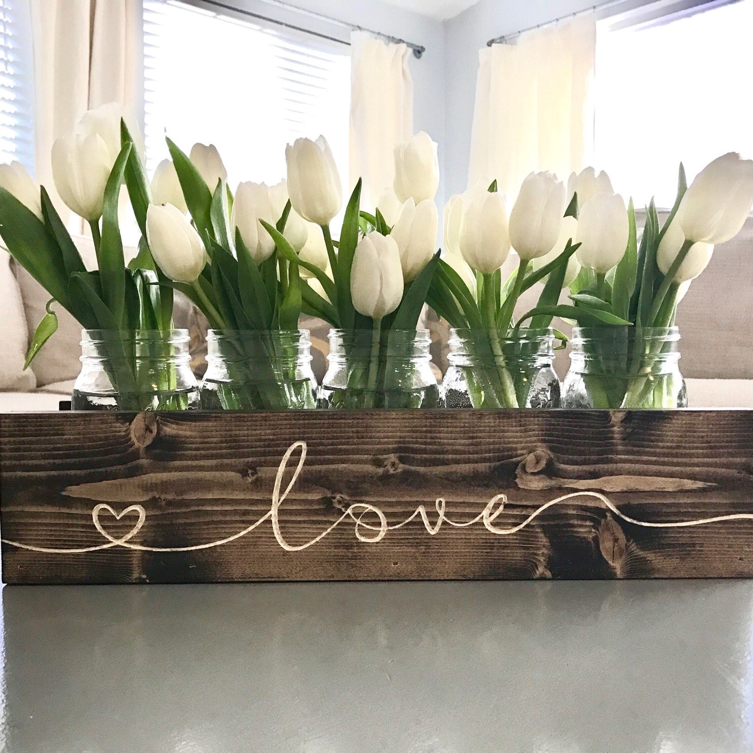 mason jars in wooden window box