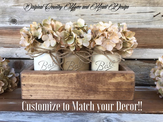 rustic mason jar centerpiece on wooden table