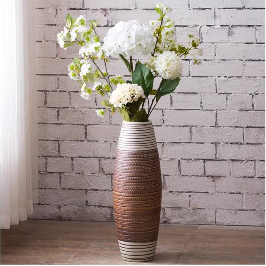dried flower arrangement in stoneware vase scandinavian living room