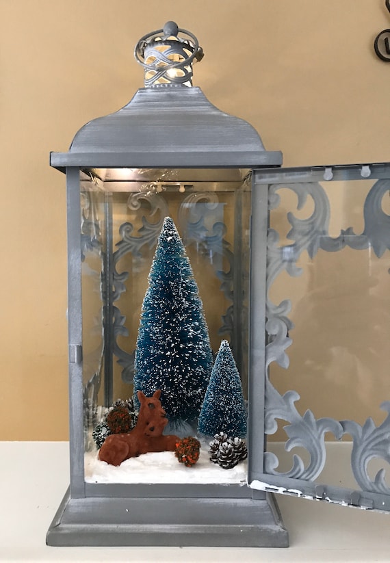 lantern filled with pinecones winter