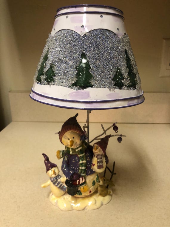 tall and short candles on winter table