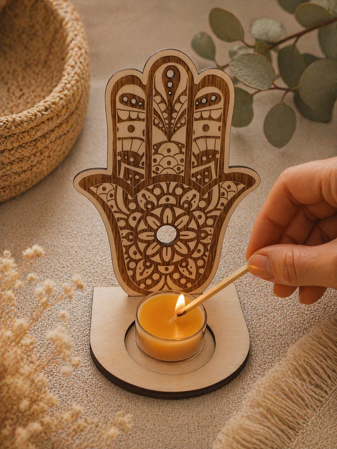 candles in protective holders on table