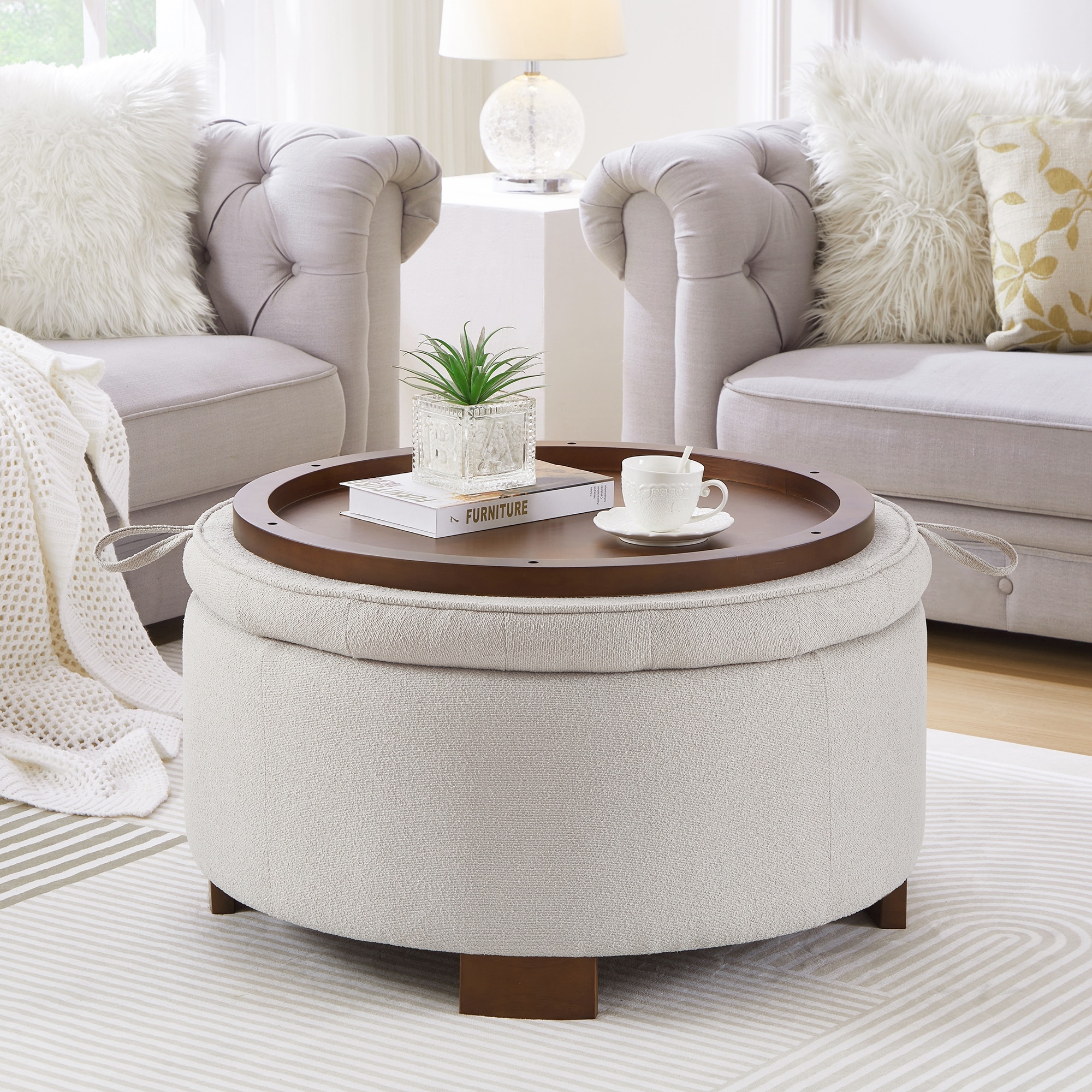 storage ottoman filled with throw pillows