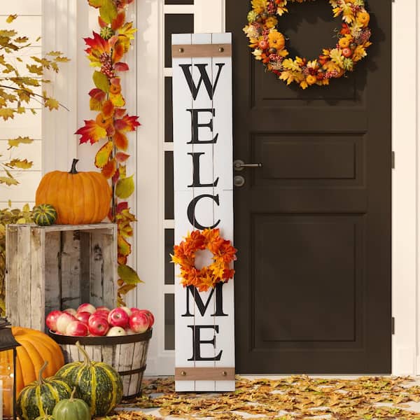 wooden welcome sign on porch