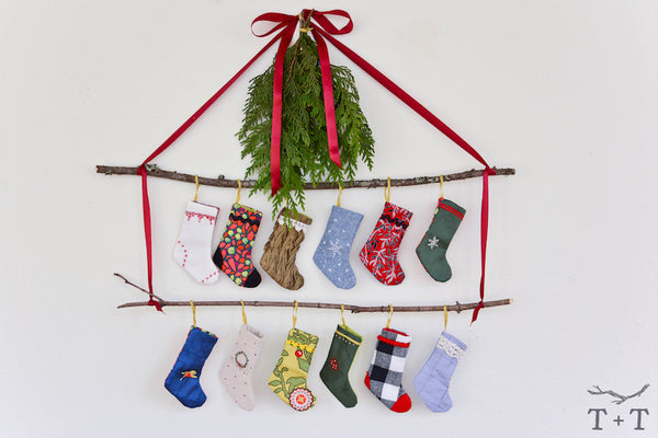 mini stocking advent calendar hanging on wall