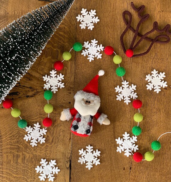 felt snowflake with pom pom center ornament