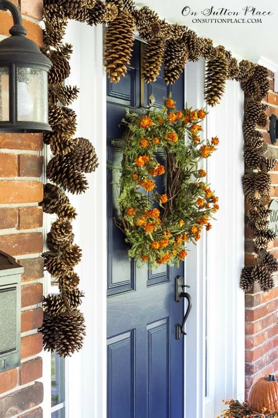 pinecone garland around window frame