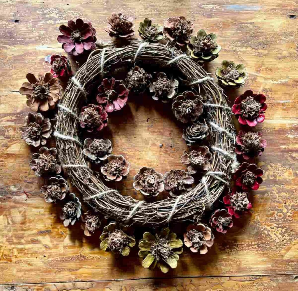 pinecone garland on bookshelf edge