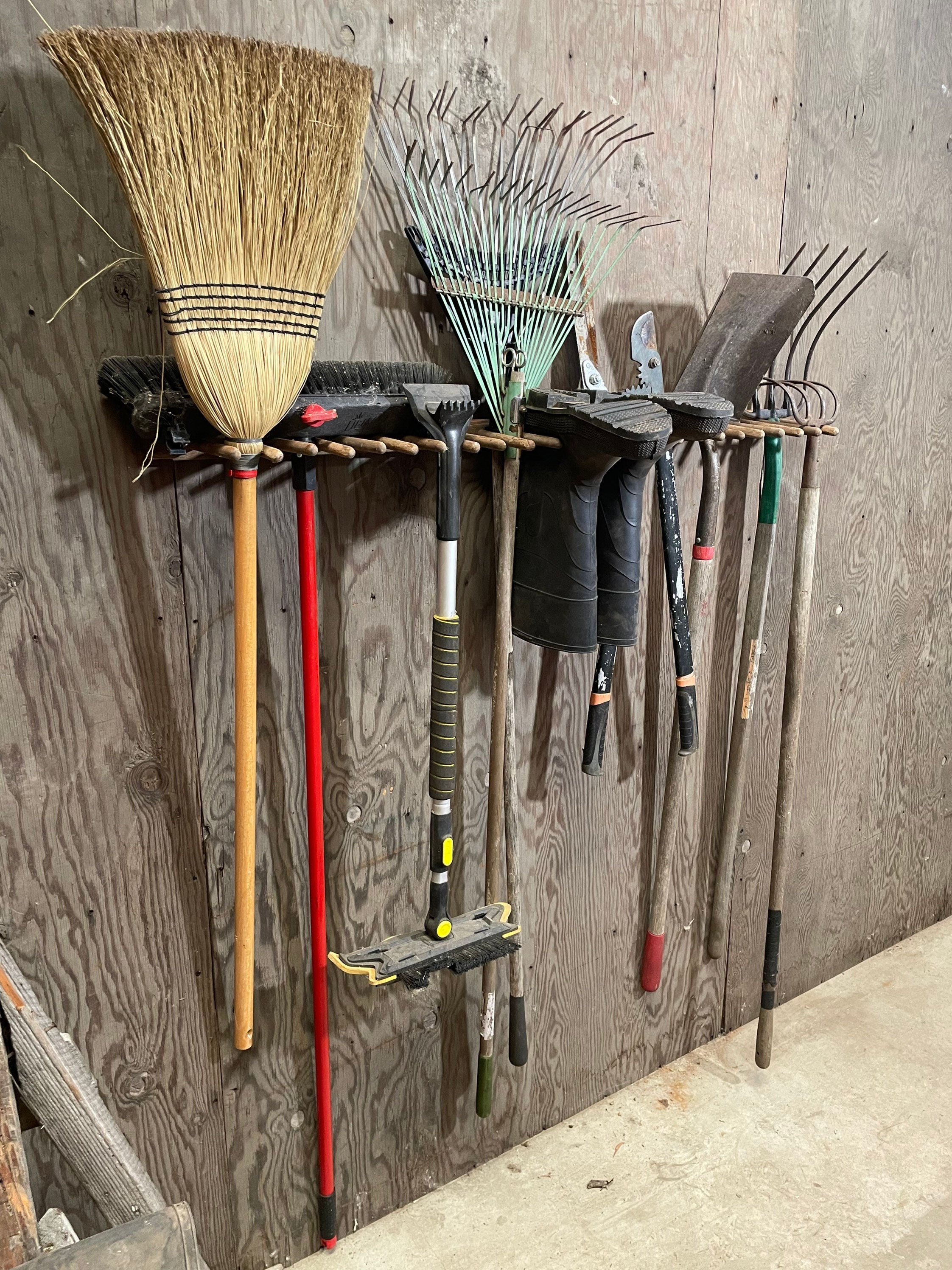 garden tools hanging on wall