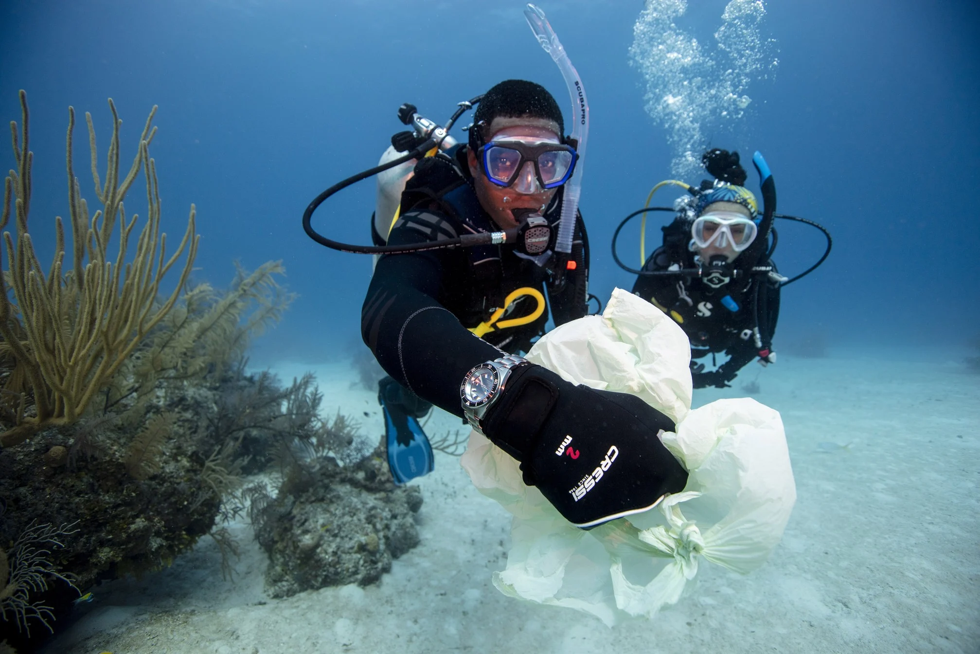 PADI divers recovering objects underwater