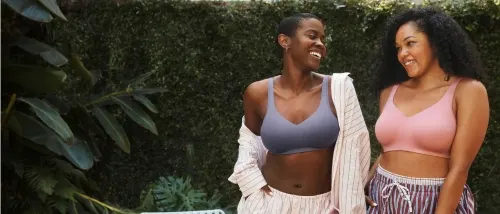 two females smiling wearing beyond comfort simple sizing bras