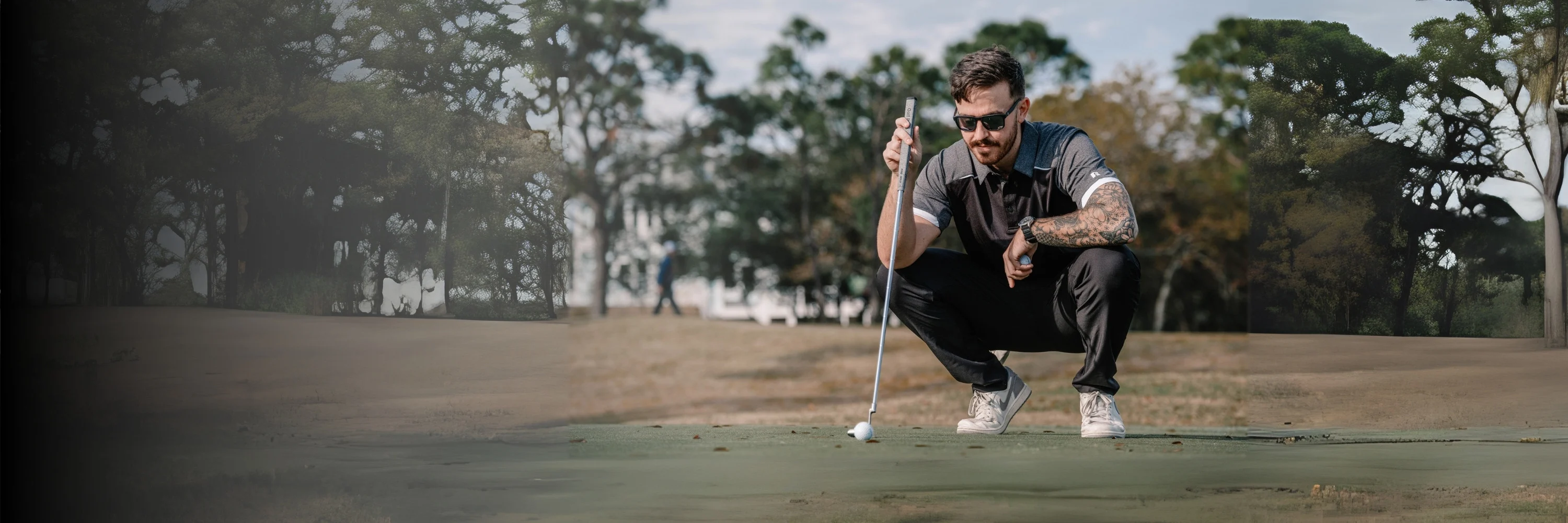 Male model wearing russell athletic gray golf polo