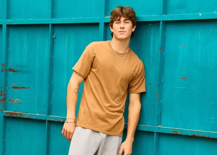 Male model wearing a tan brown short sleeve jerzee tshirt
