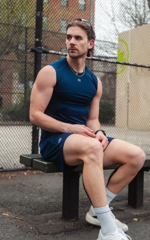 man wearing Russell athletic compression tank 