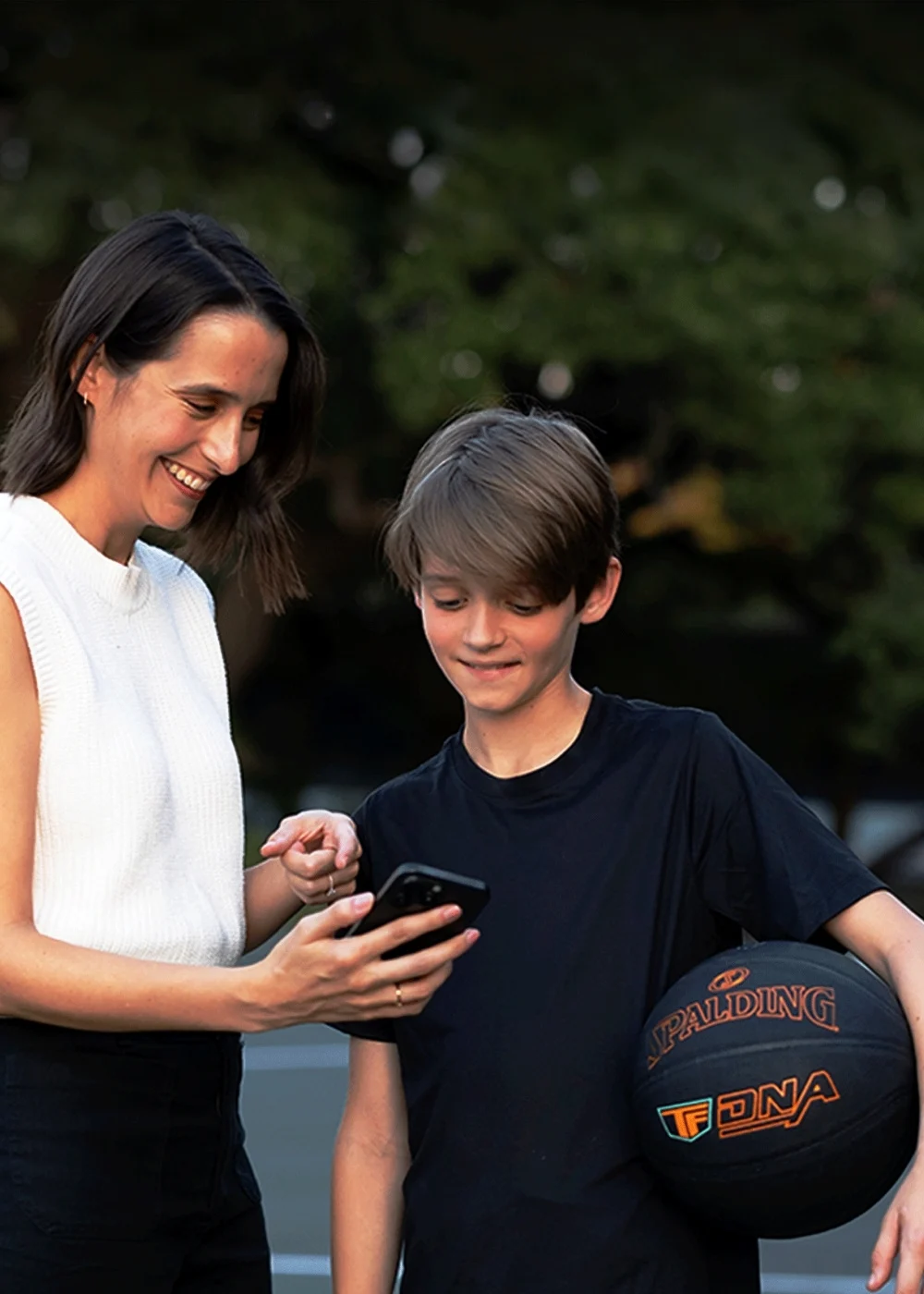 lifestyle image of mother and son using the TF DNA Smart Basketball