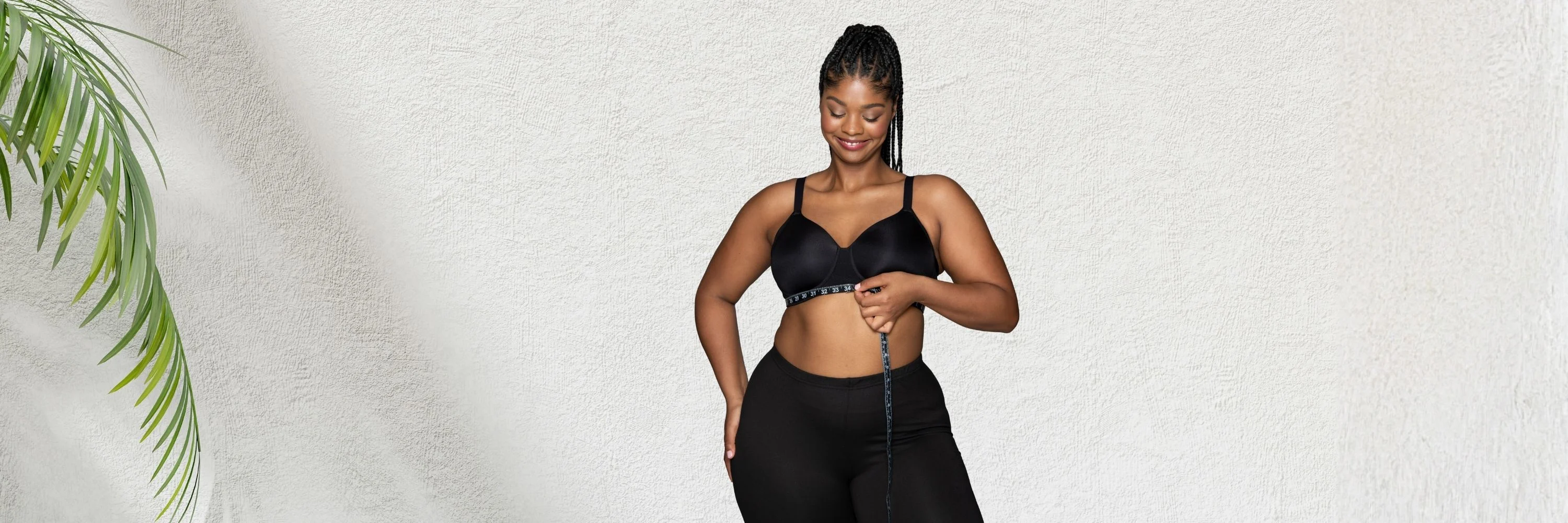 model showing how to measure correctly to find the right size bra