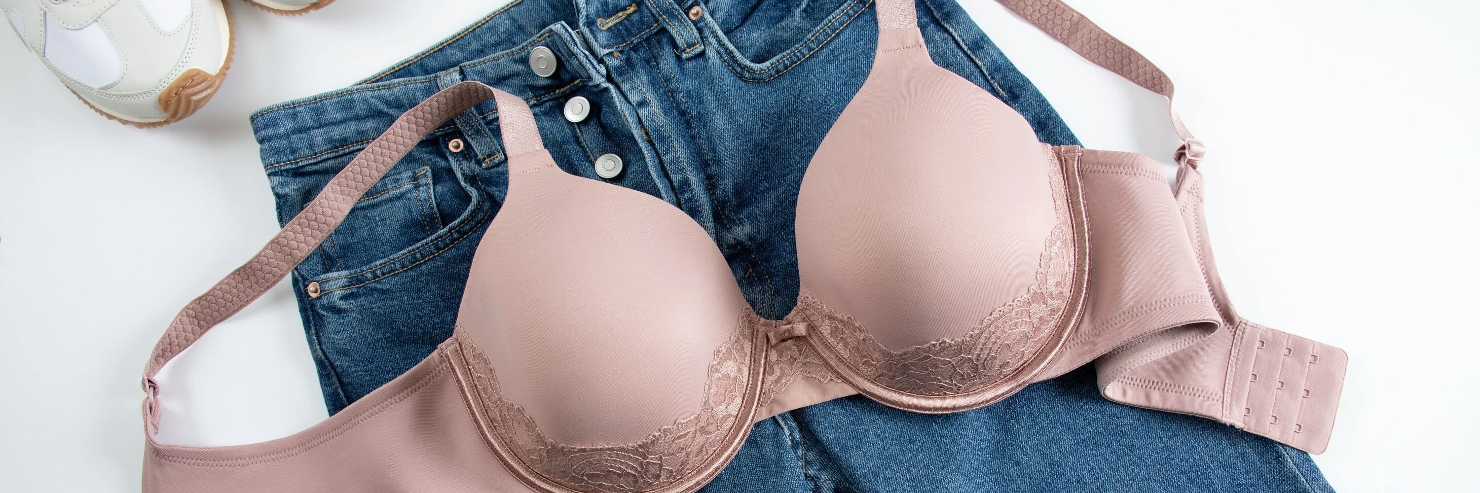 lay flat image of a full figure beauty back bra with a pair of jeans