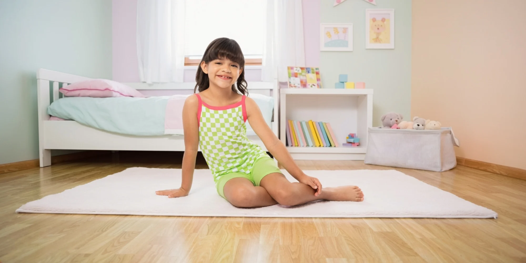 Child wearing Fruit of the Loom girls’ pajamas, highlighting soft and comfortable kids’ basics.