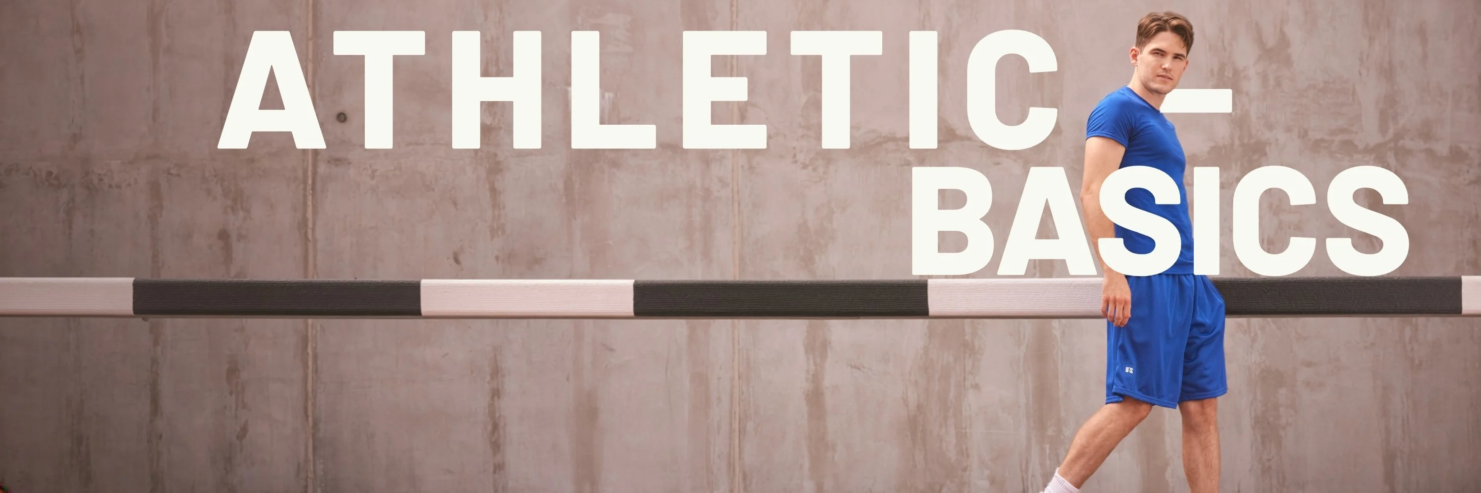 Person wearing a blue athletic tee and matching shorts wit text overlay that says Athletic- Basics