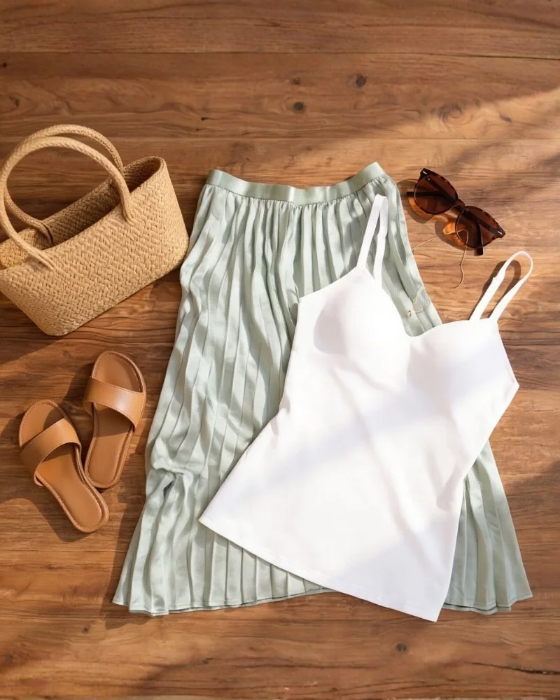 layflat of shapewear paired with a flowy skirt brown sandals and purse.