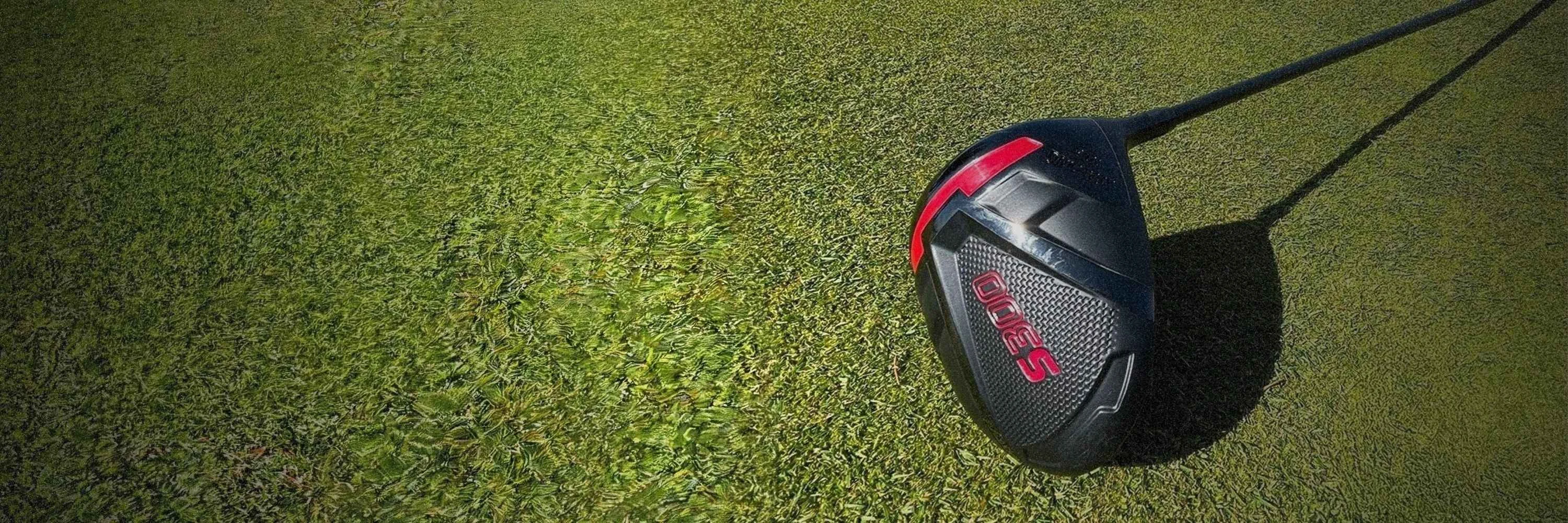 Close-up of a Spalding S300 golf club head resting on a grassy fairway.