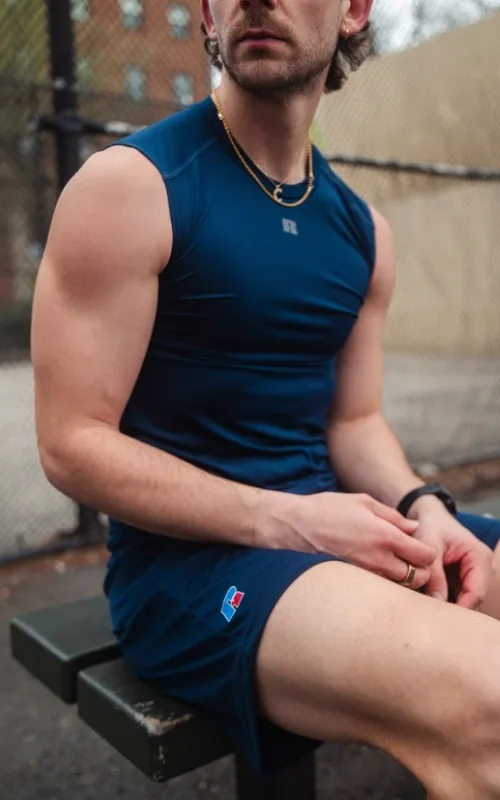 man wearing Russell athletic compression tank 