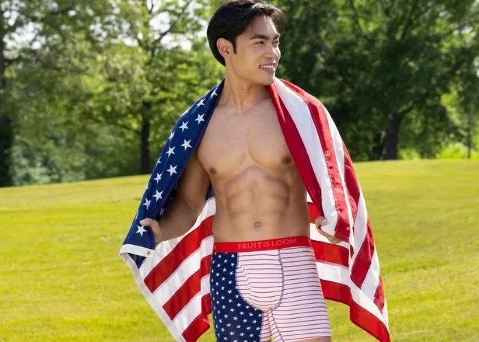A person standing in a field wearing the new americana boxer briefs