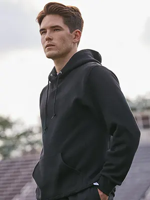 model wearing black russell athletic hoodie and sweatpant set