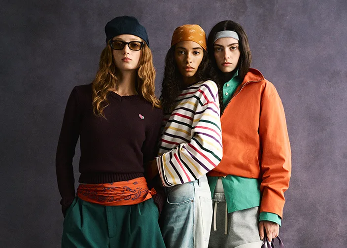 Three models showcasing the new Zara x Fruit of the Loom collection.