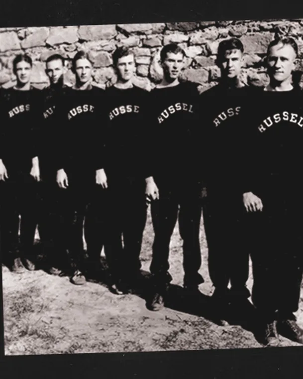 Vintage black-and-white image of five athletes wearing the first Russell sweat collection.