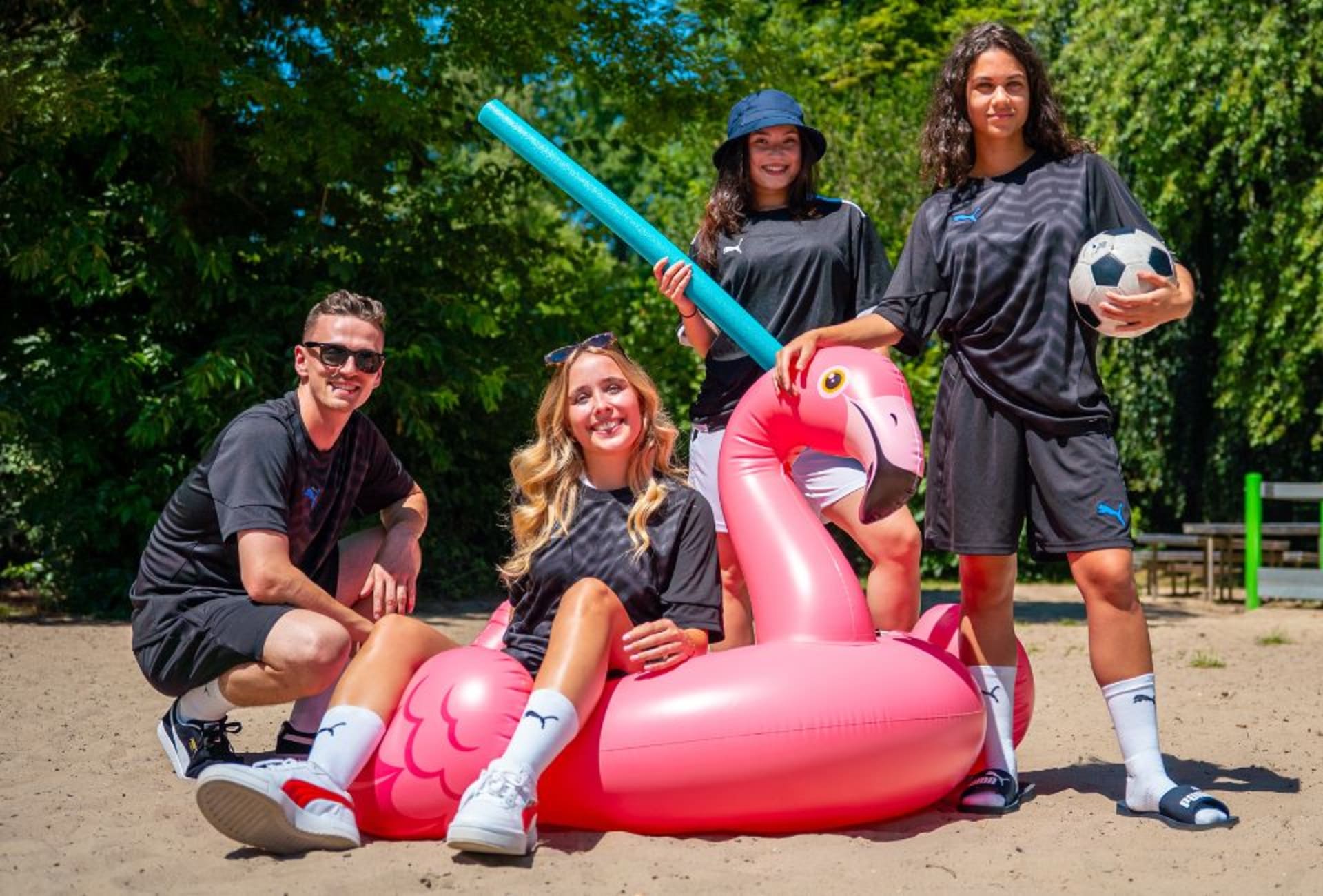 A pair of adidas Coral Blaze Pack football boots on the grass.