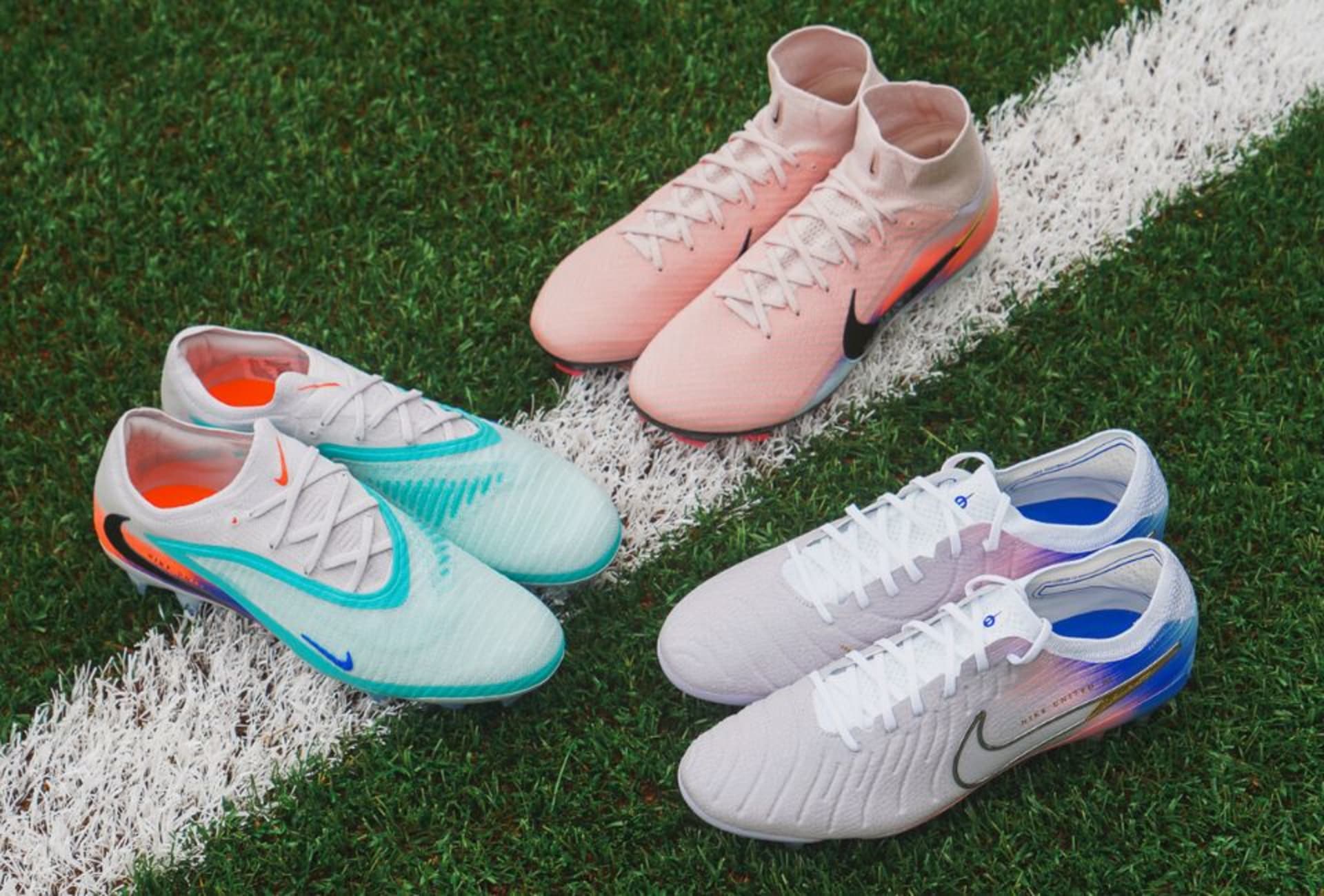 A pair of purple Nike Gear Up football boots on the grass.